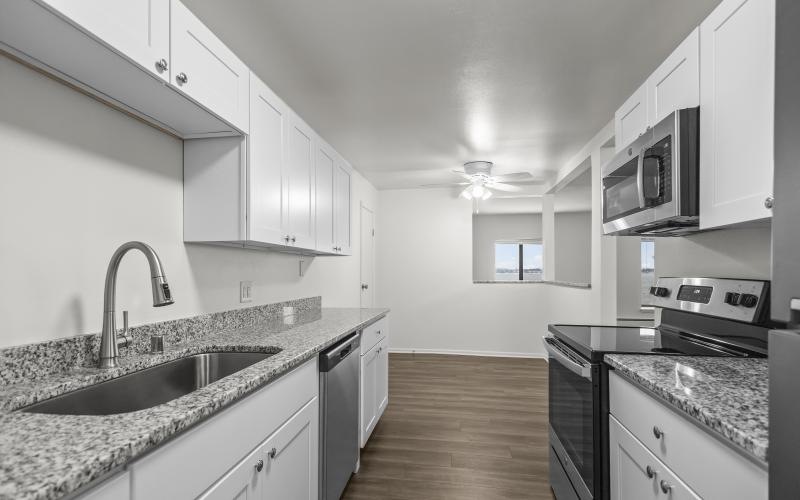 a kitchen with white cabinets