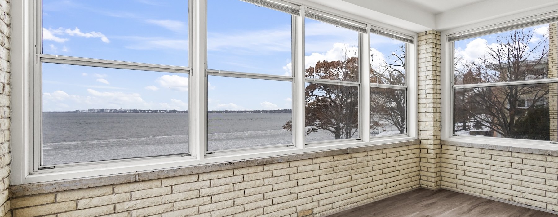 a room with windows and a wood floor