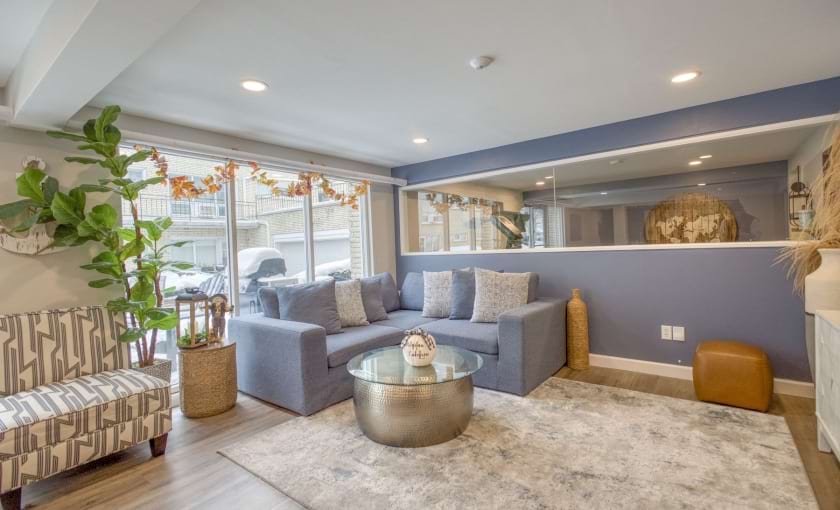 a clubroom with couches and a coffee table