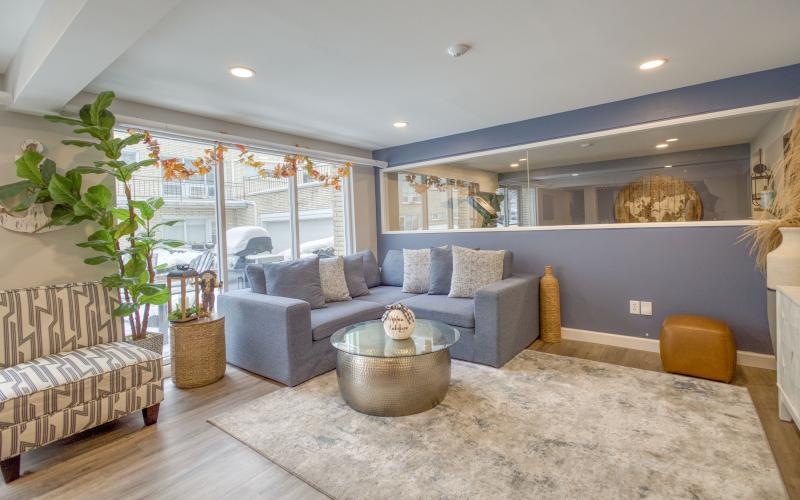 a clubroom with couches and a coffee table