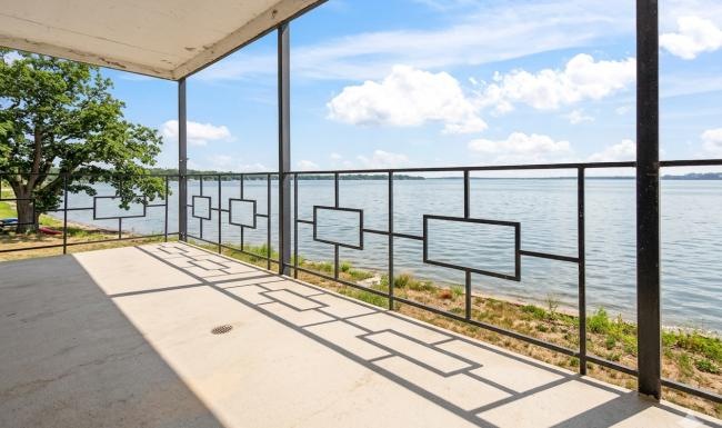 a patio next to a body of water