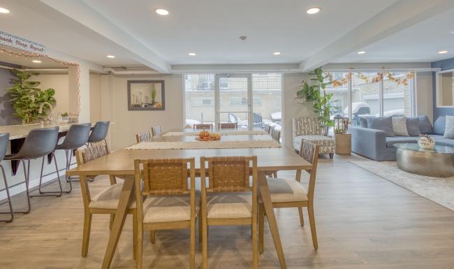 a clubroom with tables and chairs
